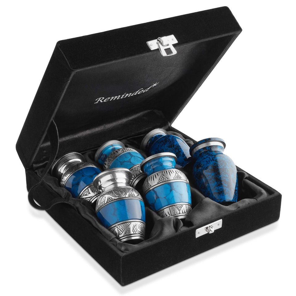 Reminded small cremation urns in blue and silver six-pack, ideal for sharing keepsakes.