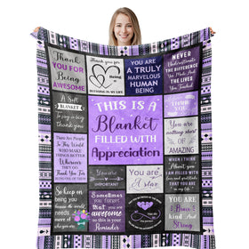 Remwiso purple throw blanket on sofa for cozy movie nights.