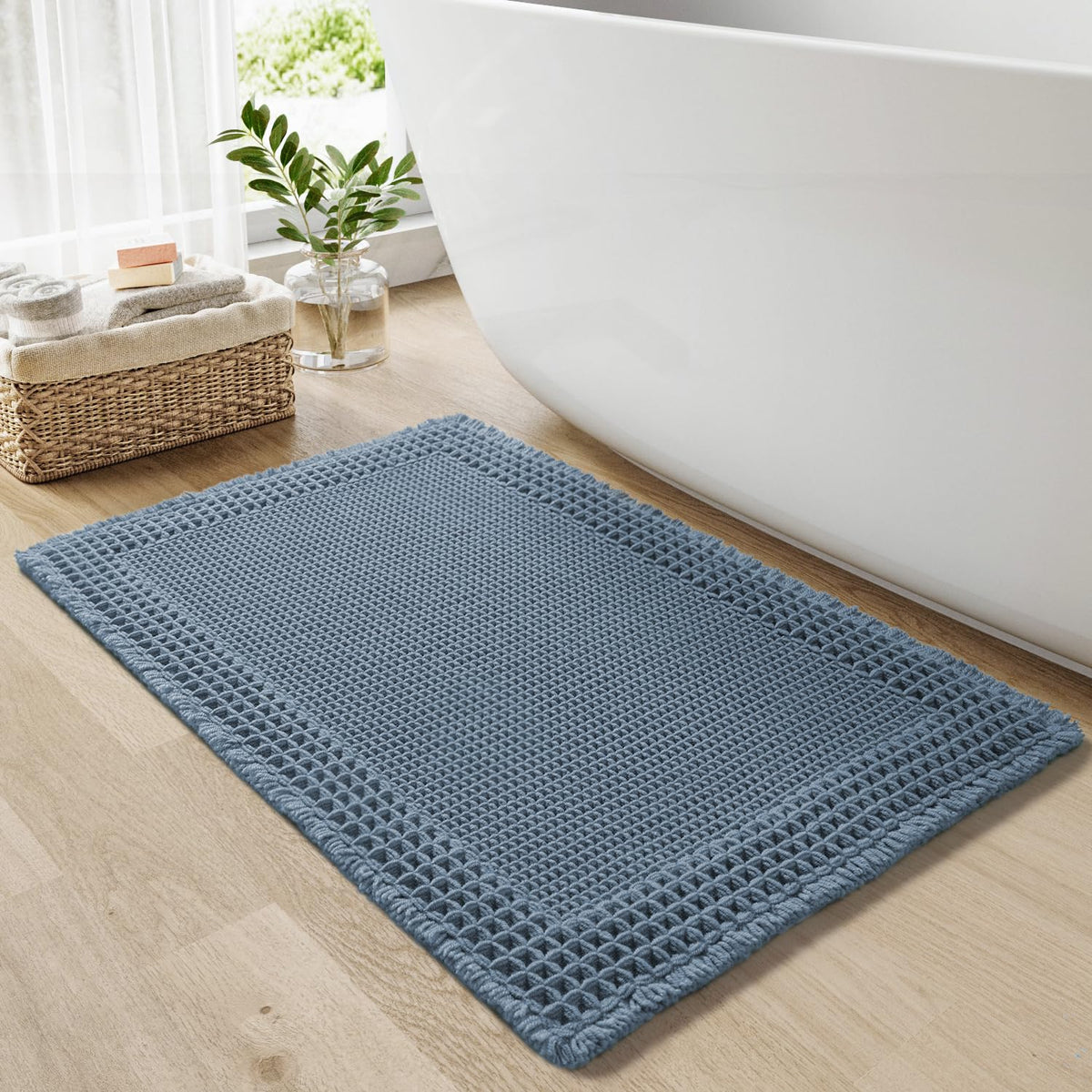 RESARE waffle bath mat in blue 18x30 absorbs water quickly for dry, comfortable steps.