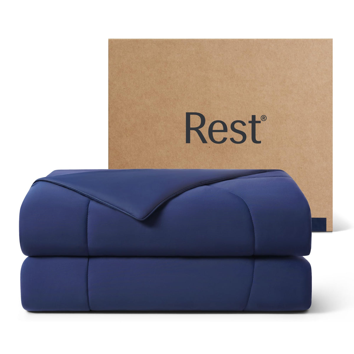 REST Evercool cooling comforter in midnight blue folded for compact storage and quick cooling.