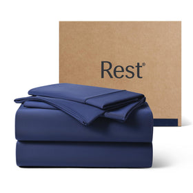 REST Evercool+ sheet set in midnight blue on queen bed for cooler sleep