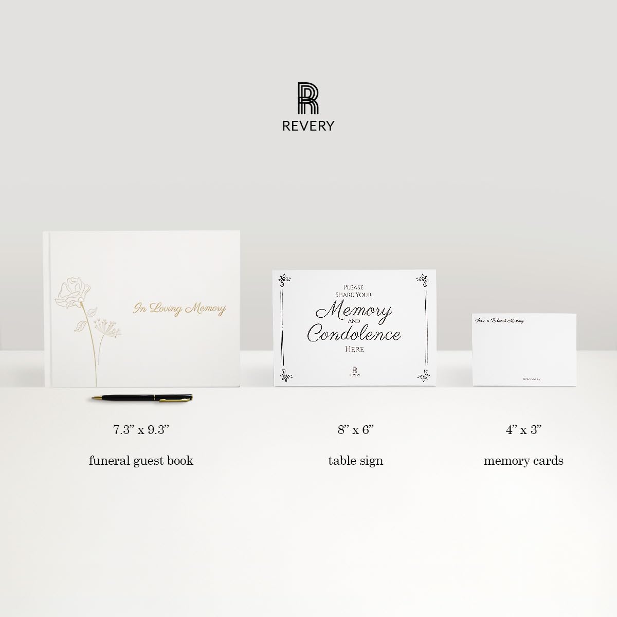 Revery funeral table sign complements a respectful tribute setup.
