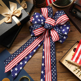 Riceshoot tree topper patriotic bow adding American flair to holiday decor.