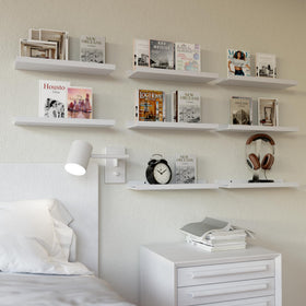 RICHER HOUSE nursery floating shelves keep baby's books within easy reach.