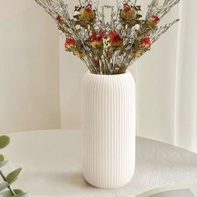 RIKBVOM white ceramic vase, compact design ideal for coffee tables.