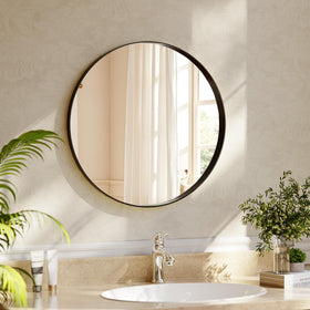 Riskioir 24-inch round mirror with deep black frame for modern bathroom ambiance.