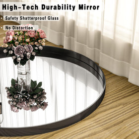 Riskioir circle mirror with concave frame elevates living room decor.