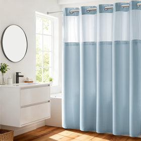 River Dream heavyweight shower curtain in blue with dotted waffle weave helps keep water in.