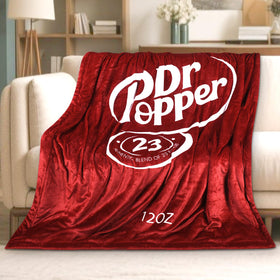 RMKA Dr Pepper blanket logo close-up, perfect for cozy lounging and fans.