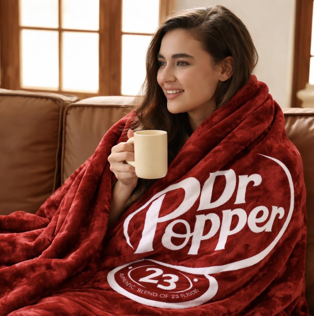 RMKA Dr Pepper blanket on a couch offers warm, movie-night comfort.
