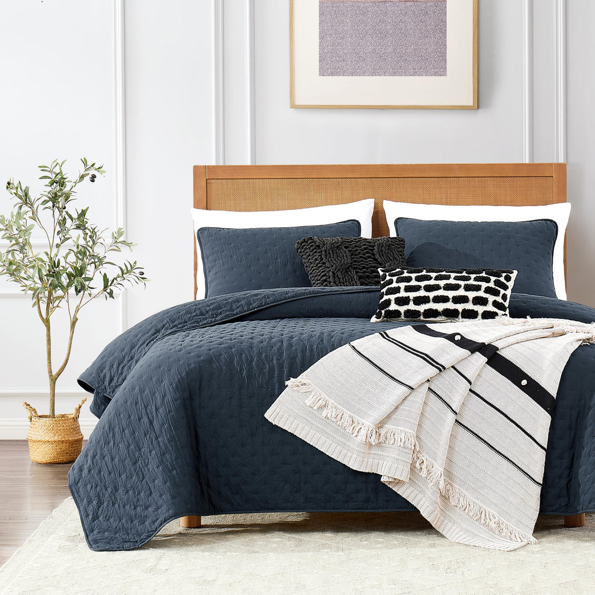 ROARINGWILD navy blue twin quilt on bed, soft and cozy warmth.