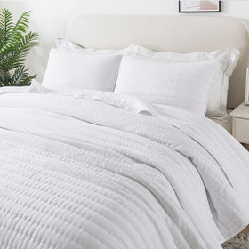 ROARINGWILD white king-size quilt on bed for all-season comfort