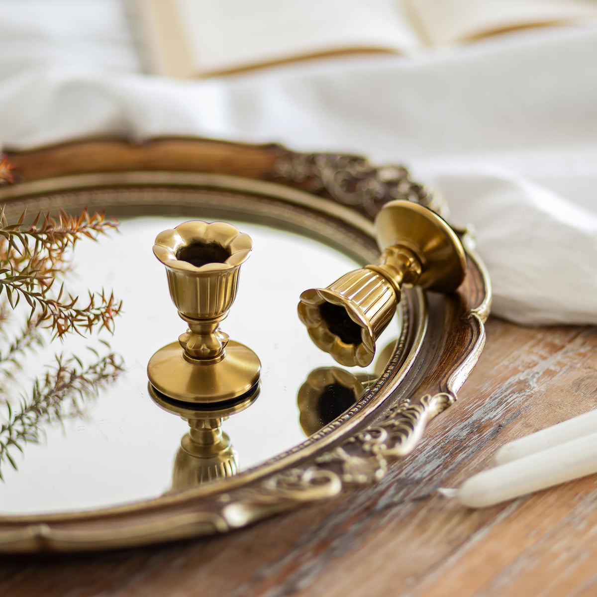 Closeup of Romadedi brass taper candle holders showing Victorian detailing