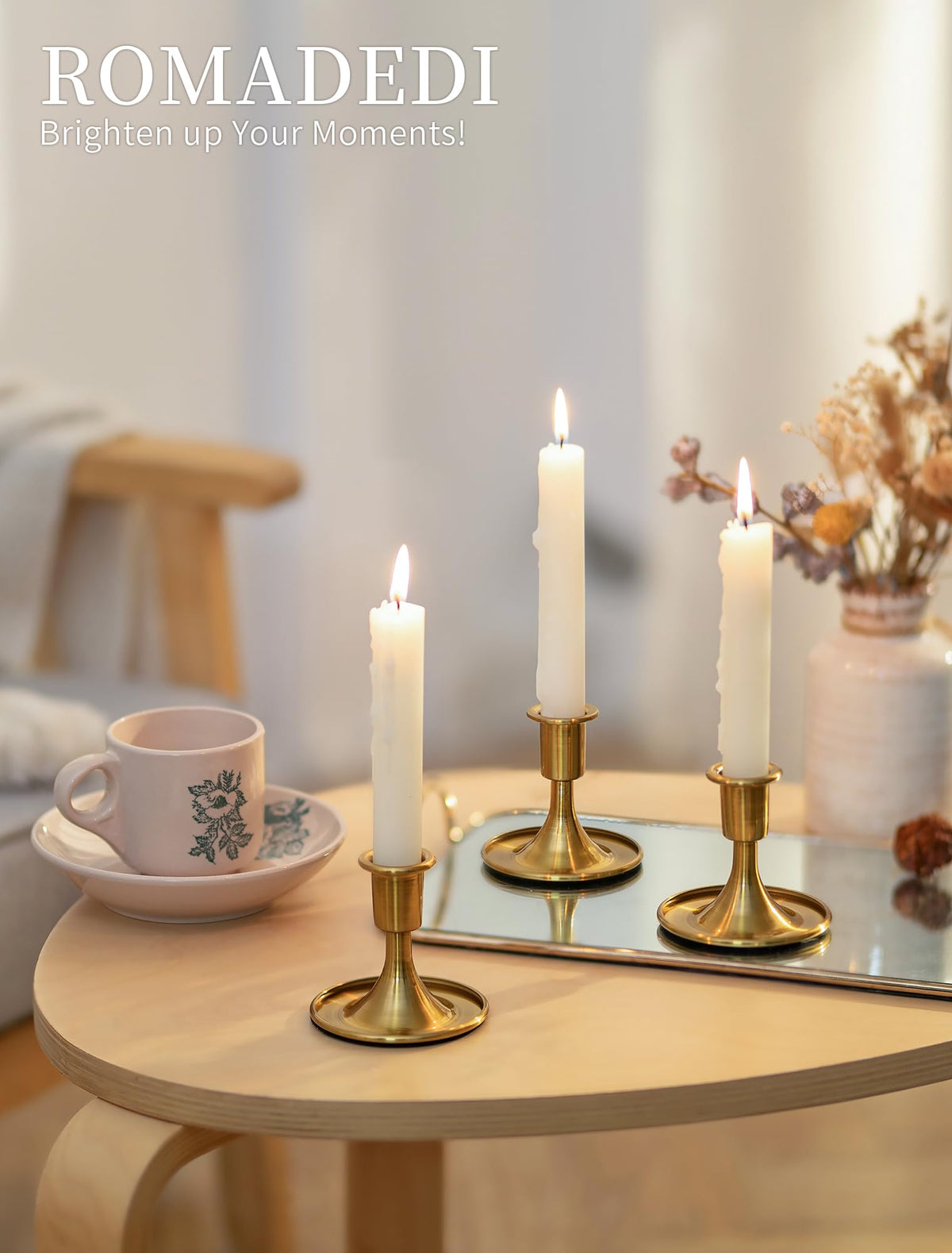 Romadedi brass-taper-holder-reflection adds luxe shine to decor.