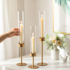 Romadedi clear hurricane glass candle holder showcases warm glow.