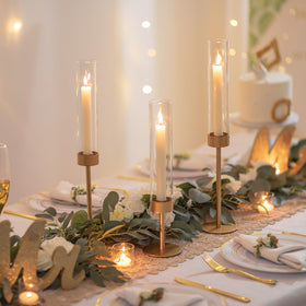 Romadedi tall metal candlestick stand elevates candlelight with 45 cm height.