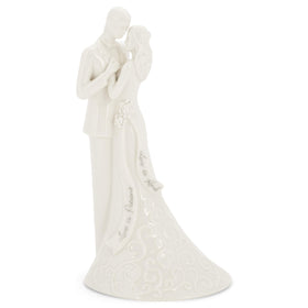Roman wedding topper with porcelain finish featuring the bride and groom for elegant cake decor
