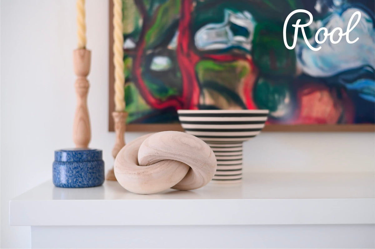 Rool chain-link wood knot decor on a bookshelf for subtle styling