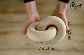 Rool beige wood knot decor displayed on a living room mantel