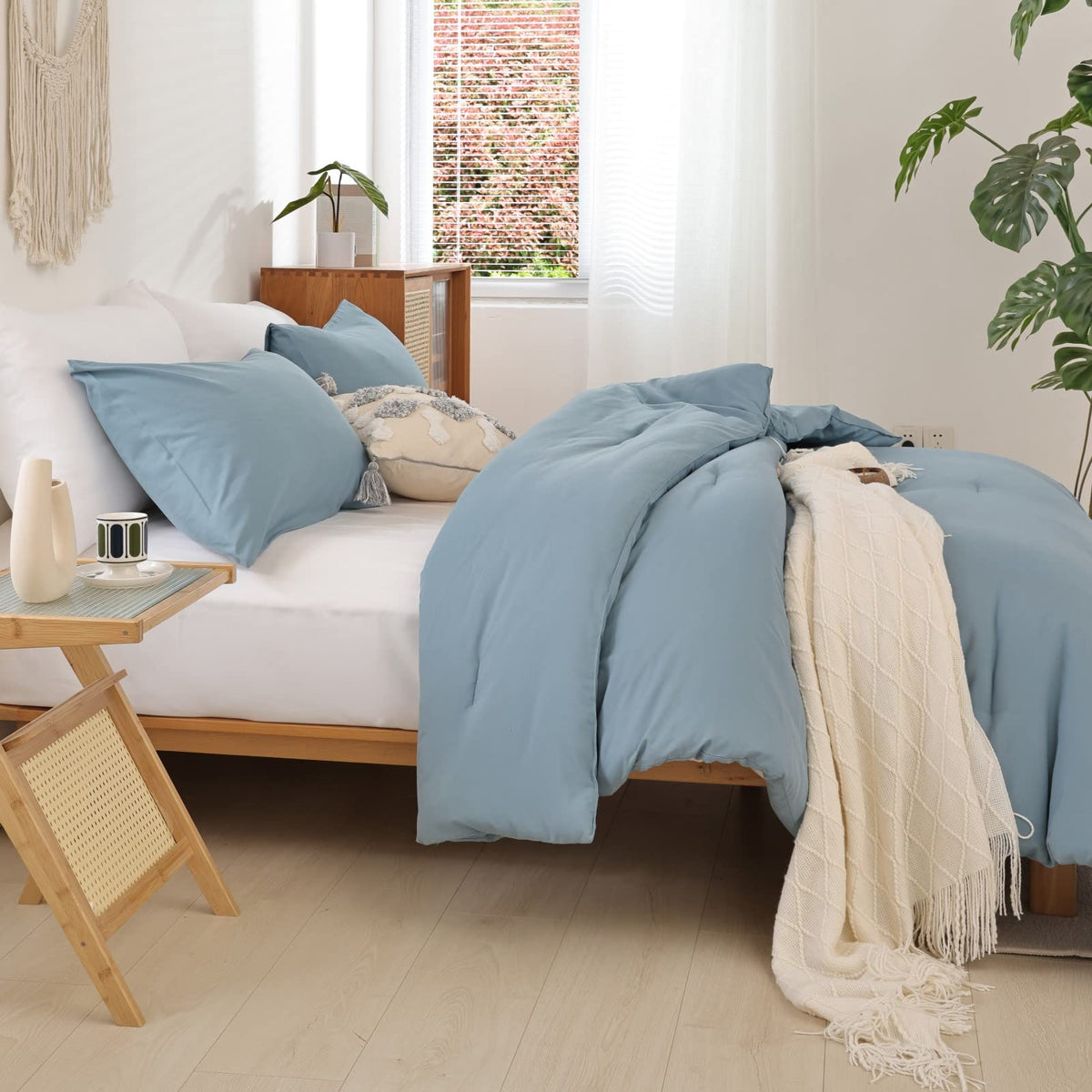 ROSGONIA blue bedding on bed demonstrates versatile queen size fit