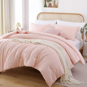 Boho blush comforter on a twin bed complements dorm room décor.