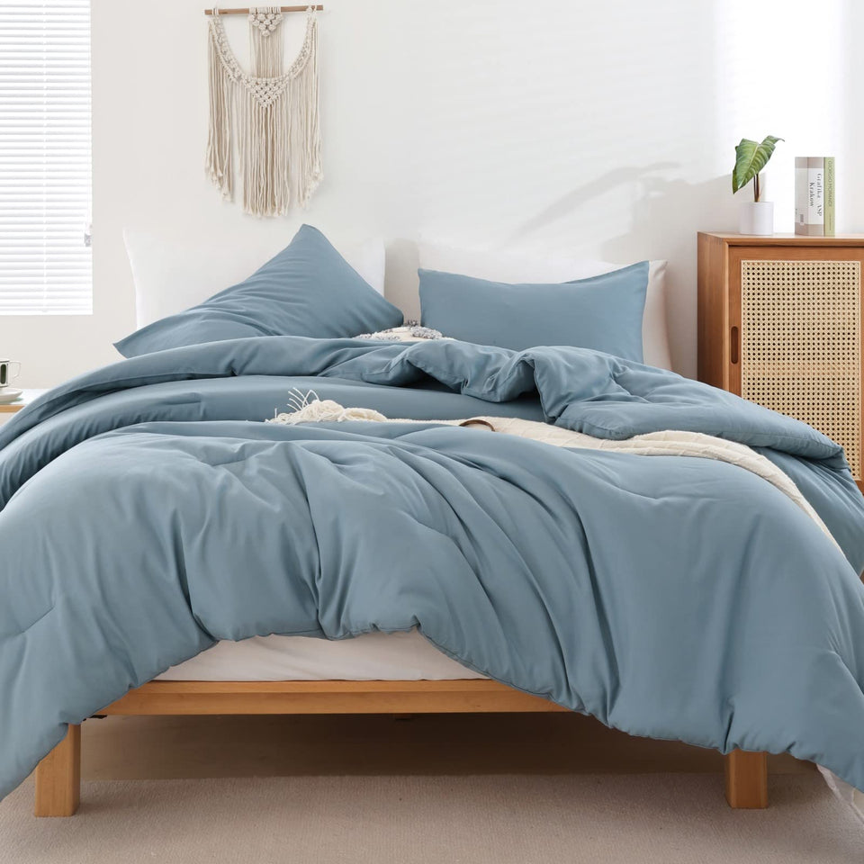 ROSGONIA dusty blue comforter on queen bed for cozy all-season lounging