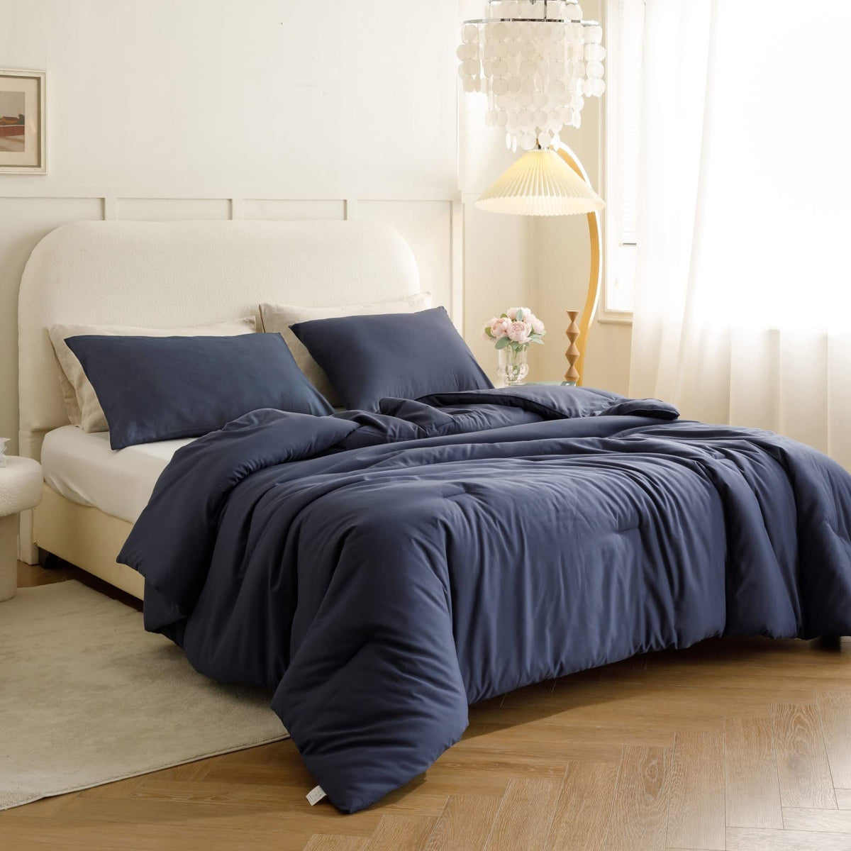 ROSGONIA navy blue comforter close-up highlights soft fabric texture.