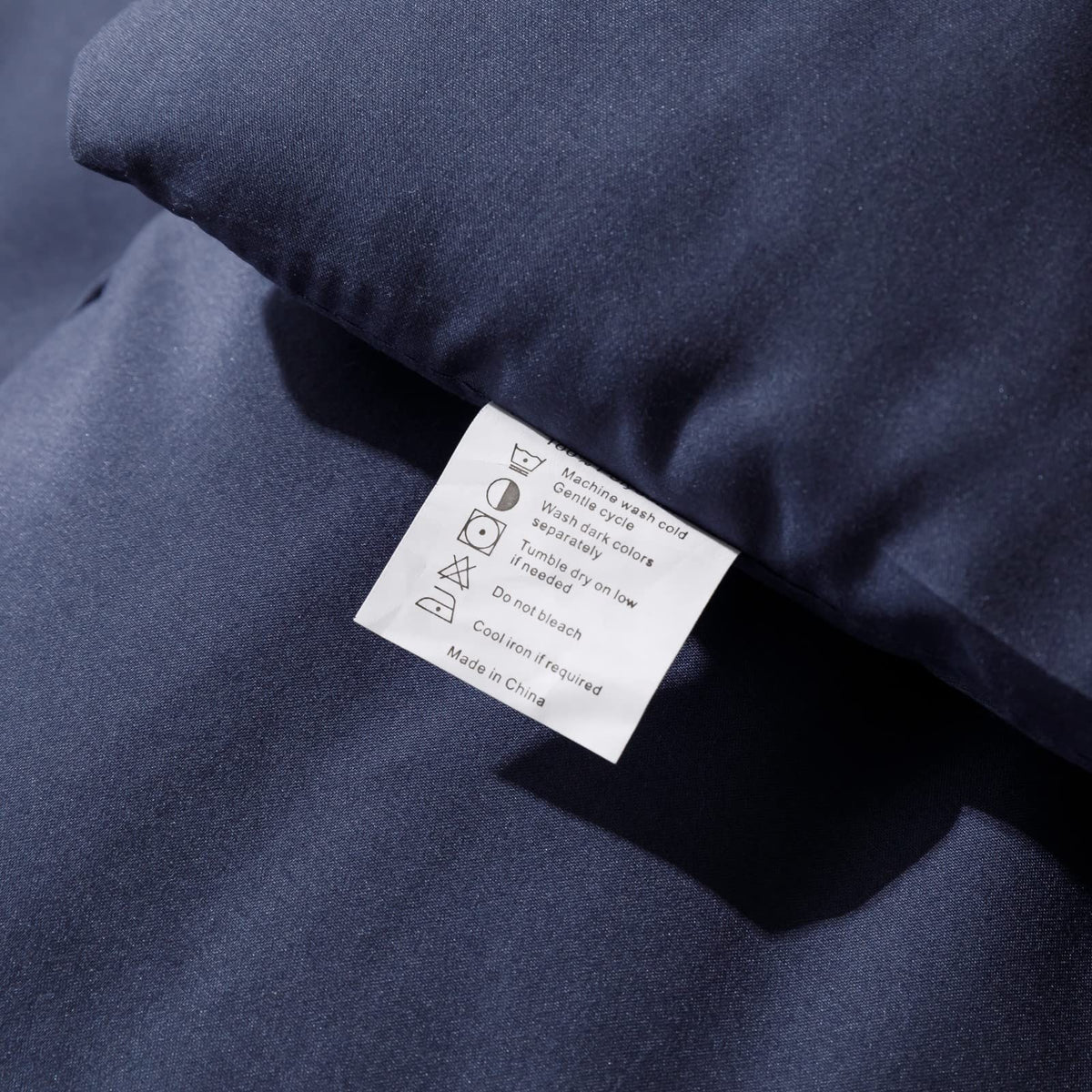 ROSGONIA navy blue comforter packaging emphasizes value and care.