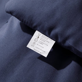 ROSGONIA navy blue comforter packaging emphasizes value and care.
