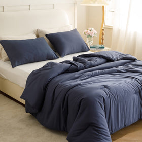 ROSGONIA navy blue comforter on a queen bed for all-season coziness.