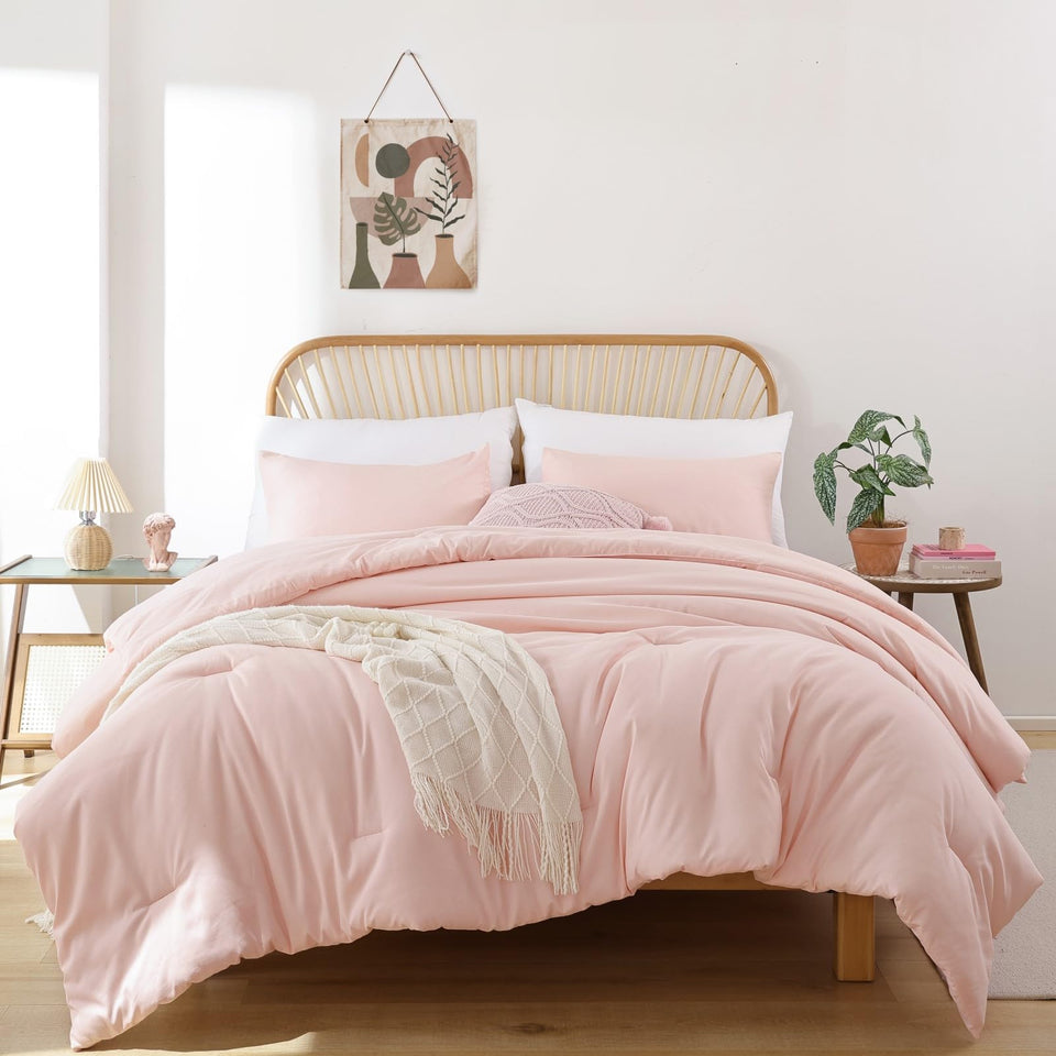 ROSGONIA Twin XL blush comforter on a dorm bed, soft and inviting.