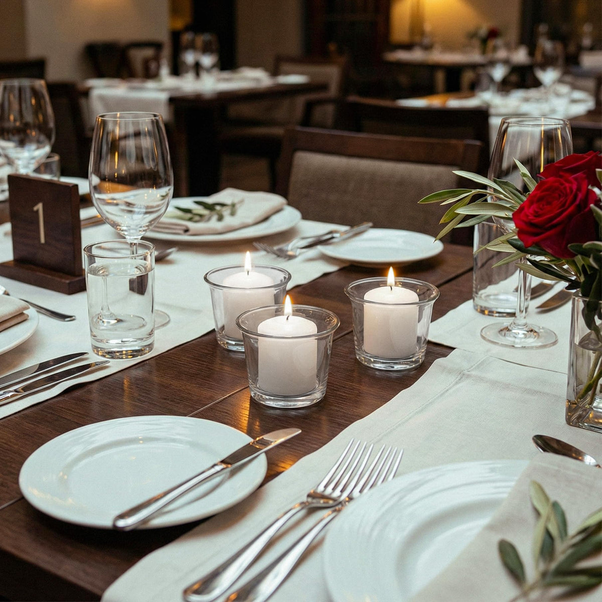 Royal Imports white votive in wedding centerpieces creates inviting ambience.