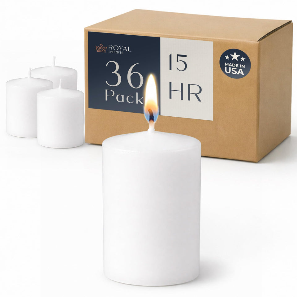 Royal Imports white 2-inch votive candle glowing softly for wedding centerpieces