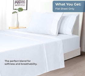 Bedroom scene with crisp white Royale Linens flat sheet.