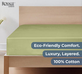 Sage green Royale Linens sheet styled on a bed
