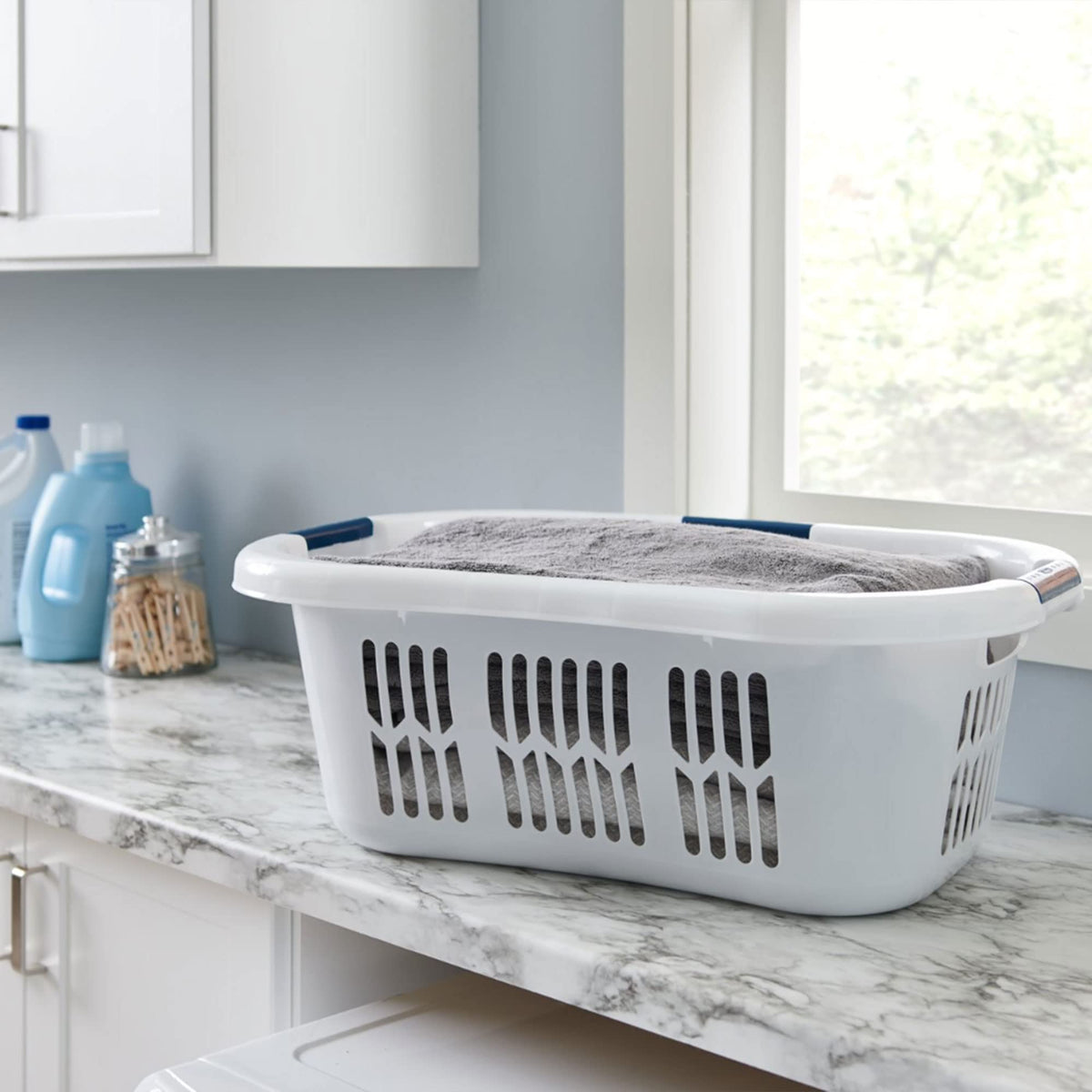 Rubbermaid 2.1 bushel capacity in a practical laundry scene.