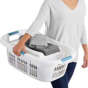 Rubbermaid white laundry basket in use on the hip.