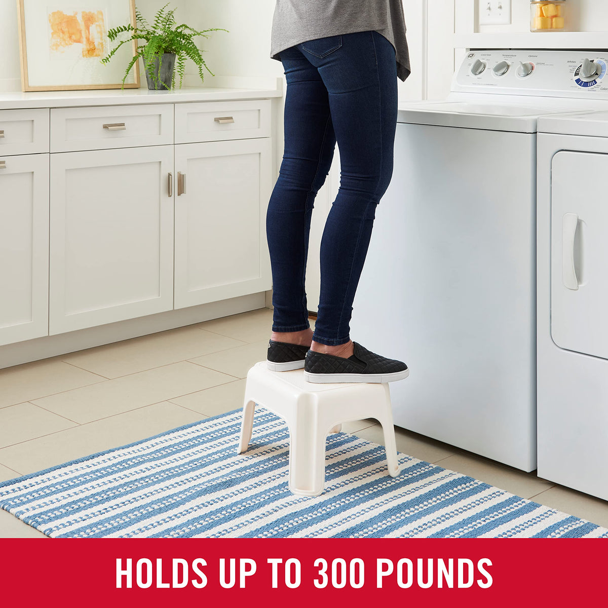 Rubbermaid Roughneck Step-Stool Bisque used in a kitchen for quick reaching tasks.
