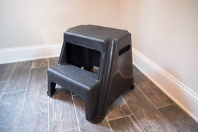 Textured grip platform helps secure footing on Rubbermaid stool.