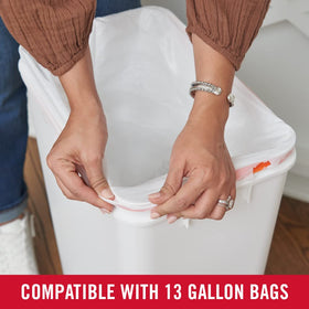 Slim profile helps fit in narrow pantry or laundry spaces with Rubbermaid Swing Top.