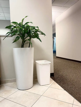 Rubbermaid waste bin with smooth inner surface cleans quickly.