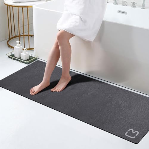 RUERYA dark grey bath mat with diatomite surface absorbs water quickly.