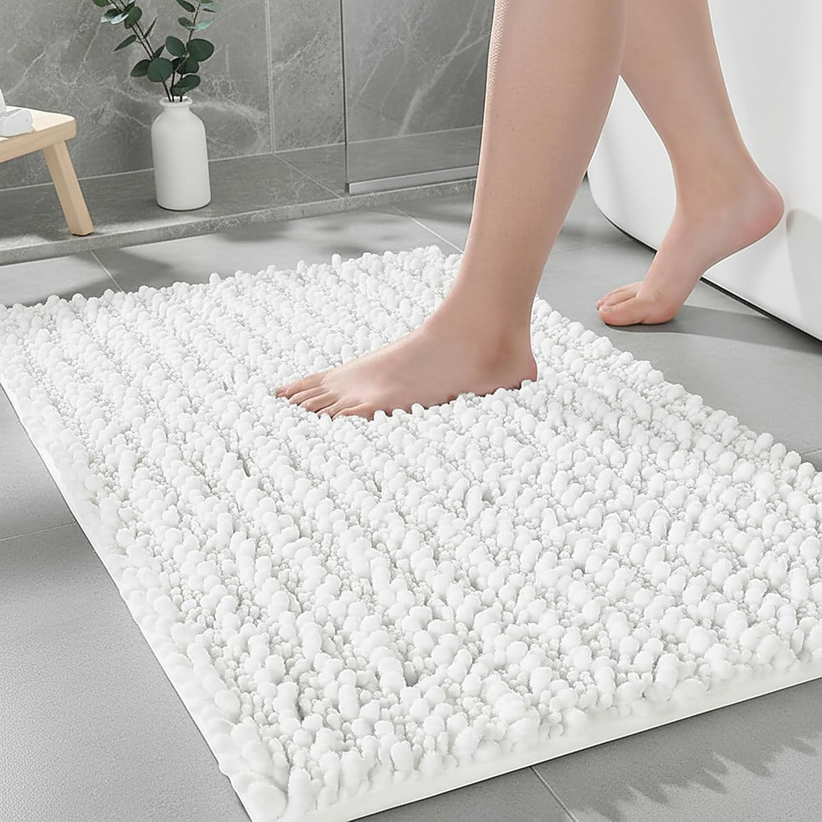 Ruggnovea bathroom rug non-slip backing keeps feet stable on wet floors.