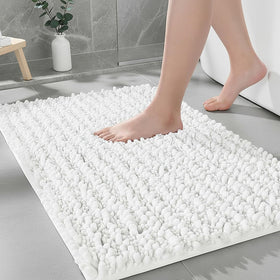 Ruggnovea bathroom rug non-slip backing keeps feet stable on wet floors.