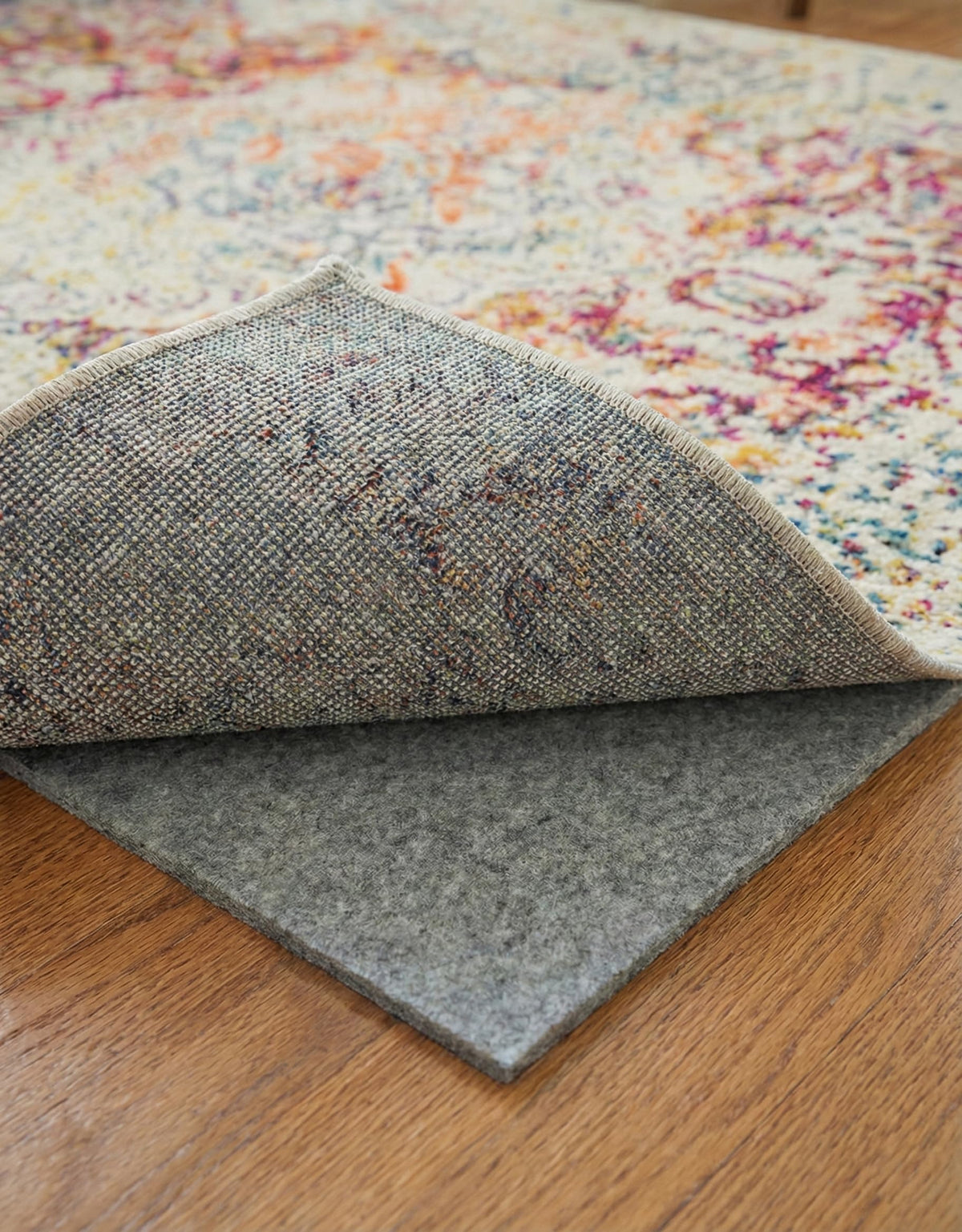 Rugs.com Everyday Performance Rug Pad on hardwood floor keeps rugs stable.