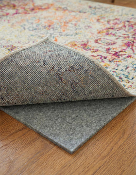 Rugs.com Everyday Performance Rug Pad on hardwood floor keeps rugs stable.