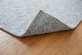 Rugs.com Everyday Performance Rug Pad packaging shows sizes and options.