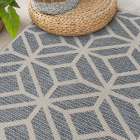 Rugshop blue contemporary geometric rug hose-wash feature in action