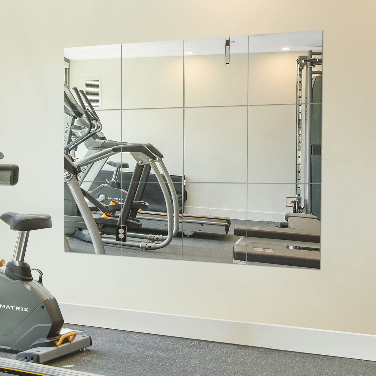Ruomeng 12x12 frameless mirror tile wall-mounted for flexible home gym setups.