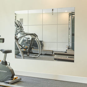 Ruomeng 12x12 frameless mirror tile wall-mounted for flexible home gym setups.